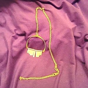 Gold tone geometric shape necklace on 20" chain